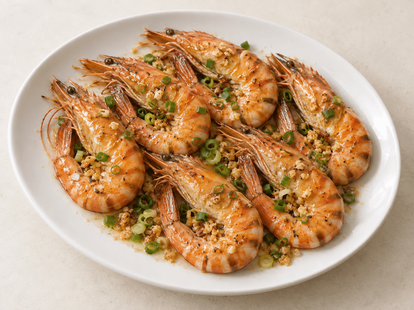 Pan-fried tiger prawns served with garlic butter on a plate